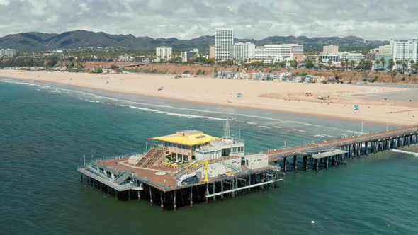 Drone Is Flying Above Empty Pier and Beach at the Ocean Shore,  Santa Monica