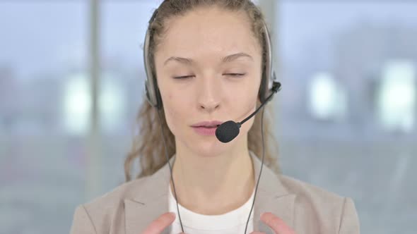 Close Up of Young Businesswoman Video Chatting with Head Phones