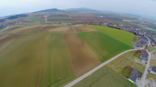 Flying Over Cultivated Fields, Green Pastures, Farmland. Agricultural Industry