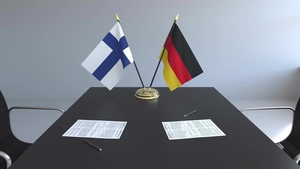 Flags of Finland and Germany on the Table