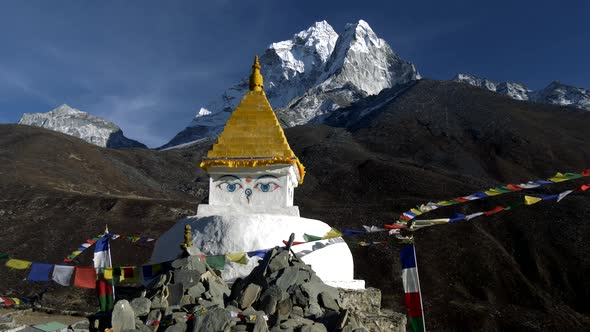 Buddhist Stupa on Mountain Trekking Path in Himalayas, Nepal. Crane Shot