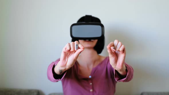 Woman Using Virtual Reality Headset in Living Room 4k