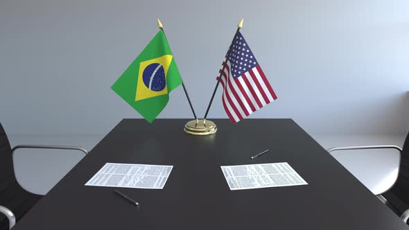 Flags of Brazil and the United States on the Table alt