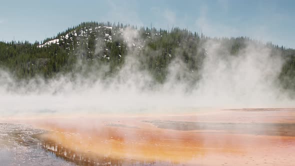 Epic View of Steaming Geyser Grand Prismatic Basin in Yellowstone National Park