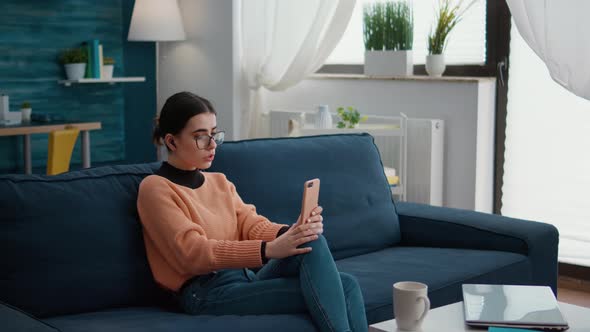 Female Student Talking on Mobile Phone Videoconference