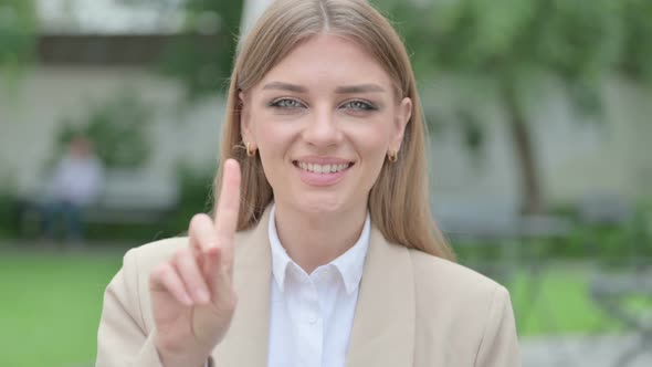 Outdoor Portrait of No Sign By Young Businesswoman By Finger Shake