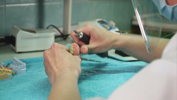 Dental Laboratory Staff Making Dental Implant