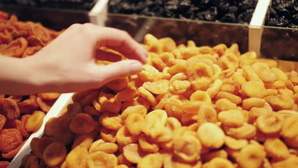 Hands of Customer Choose Healthy Snack