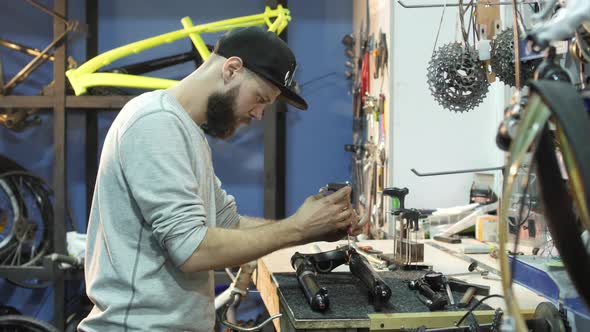 Man fixing a bike fork