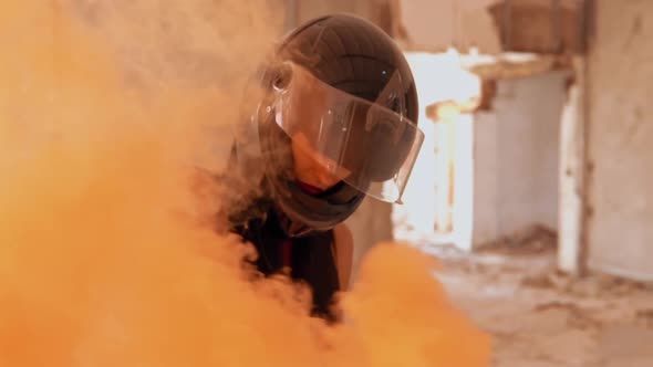 Person in Motorbike Helmet Smoke Bomb