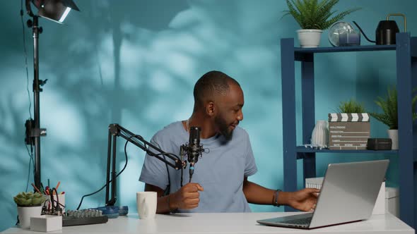 African American Influencer Holding Present Box on Camera