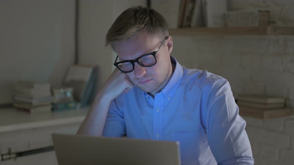 Businessman Falling Asleep While Working Late Night