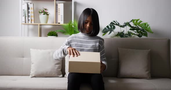 Teen girl opening gift box