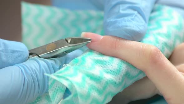 Trimming the Cuticle in Beauty Salon Close Up