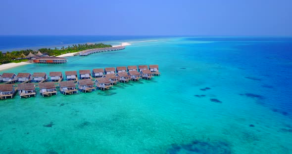 Luxury aerial copy space shot of a white sand paradise beach and aqua blue water background in colou