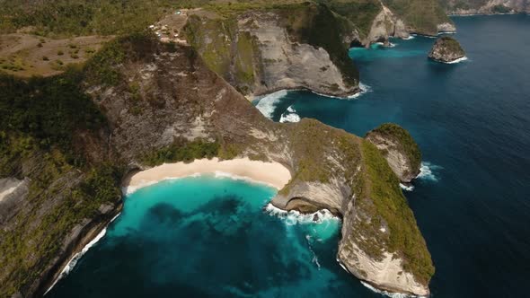 Rocky Cliff with Beach in the Sea. Karang Dawa