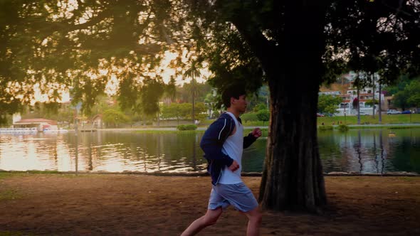 Young Asian man working out in a park in Los Angeles.