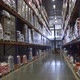 A Closing in Shot on a Working Forklift Inside a Huge Warehouse  - VideoHive Item for Sale