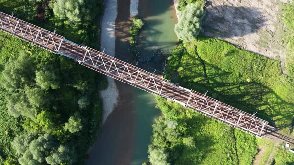 Train Moving on Bridge Above a River