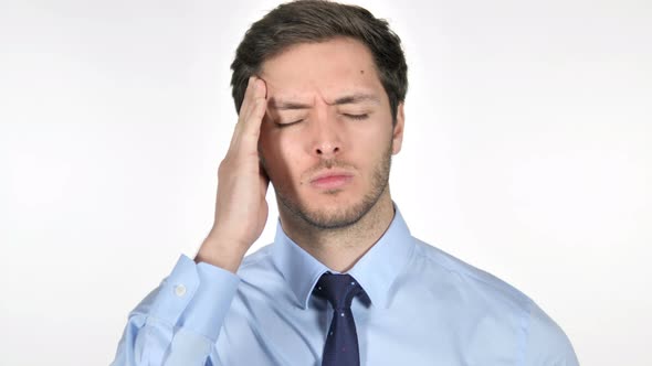 Stressed Young Businessman with Headache on White Background