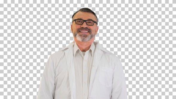 Senior doctor standing and smiling to camera, Alpha Channel