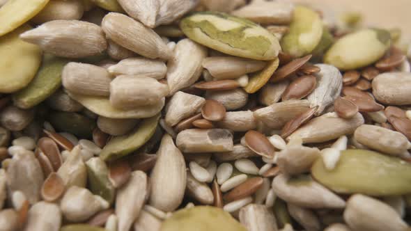 Sesame, Sunflower and Pumpkin Seeds Close Up. Pile of Shelled Edible Seeds Background