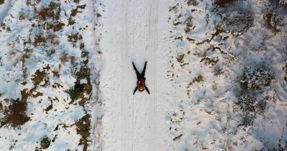 Aerial Shot of Woman Playing on Snow