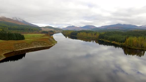 Aerial view of Laggan dam artificial lake and beautiful countryside and wood