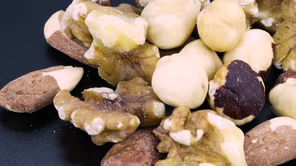 Close up detailed rotating shot of a trail mix: nuts, walnuts, almonds and hazelnuts mix macro shot,