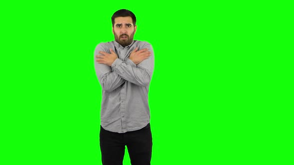 Brunette Guy Froze and Trying To Keep Warm. Green Screen