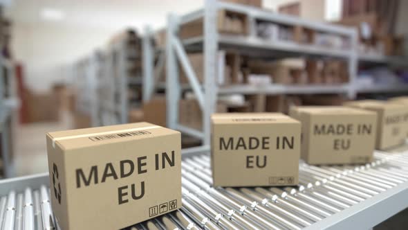 Boxes with MADE IN EU Text on Conveyor