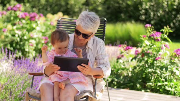 Grandmother and Baby Granddaughter with Tablet Pc