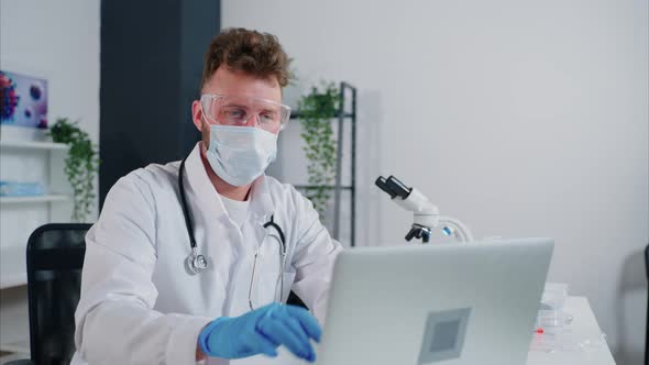 General Practitioner Working on Laptop