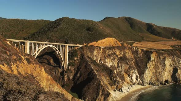 wide angle pan of bixby bridge along the california coast in big sur