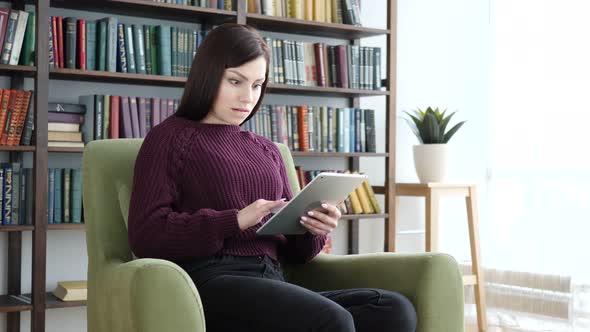 Shocked, Stunned Woman Using Tablet for Browsing