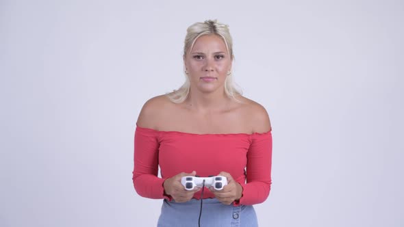 Young Stressed Blonde Woman Playing Games and Losing