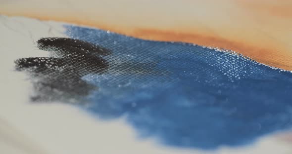 Macro shot of an artist painting with water colors and acrylics