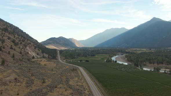 Aerial View of Scenic Road, Hwy 3, in the valley around the Canadian Mountain Landscape. Near Osoyoo