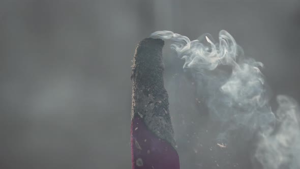 Smoke is release from red joss stick. 