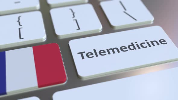 Telemedicine Text and Flag of France on Computer Keyboard