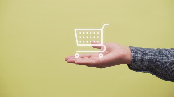 online shopping concept. business man hand show a shopping cart on her hands. e commerce. store