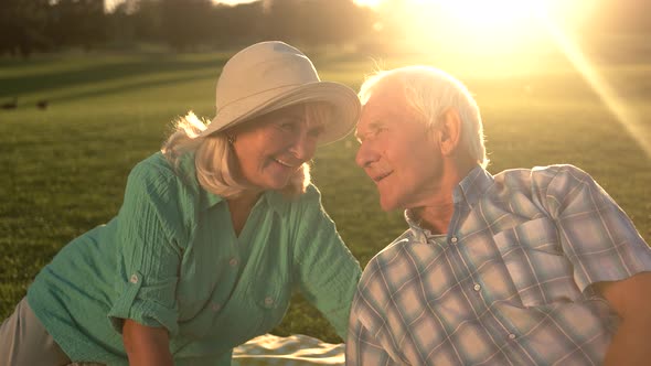 Senior Man Talking To Woman