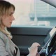 Young Woman Uses a Programnavigator on the Tablet Sits on the Driver Seat in the Car - VideoHive Item for Sale