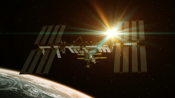 International Space Station Rotates Solar Panels On Background Of Rising Sun