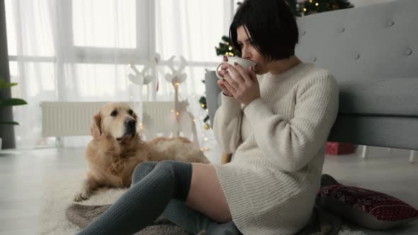 Girl with Cocoa and Golden Retriever Dog