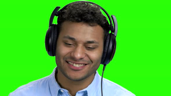 Close Up Happy Cheerful Man Listening Music in Headphones