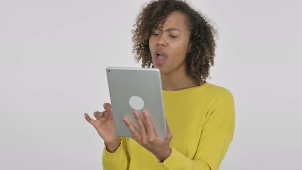 Young African Woman Reacting to Loss on Tablet on White Background