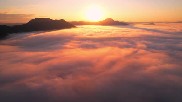 4K Drone Flying in the clouds. Flying through the clouds during sunrise