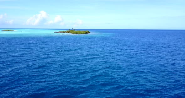 Natural above clean view of a white sand paradise beach and aqua blue ocean background in best quali