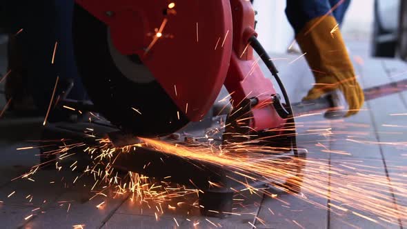 Professional Mechanic is Cutting Steel Metal
